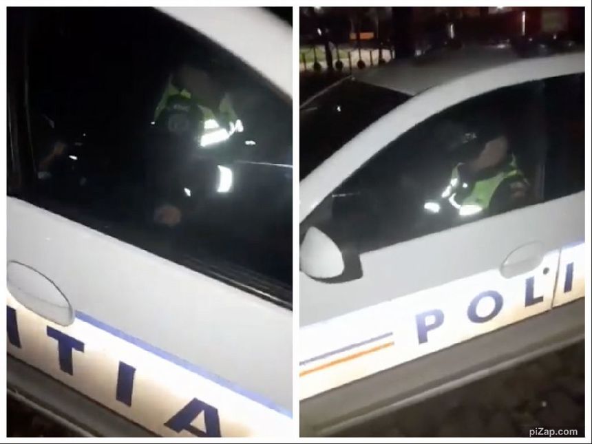 VIDEO Un polițist și un jandarm filmaţi dormind în maşina de poliție în timpul serviciului